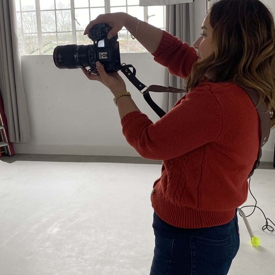 Trish working in a bright studio by a big window